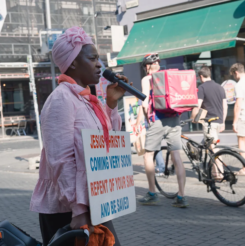 Portrait in the city with layered reflections